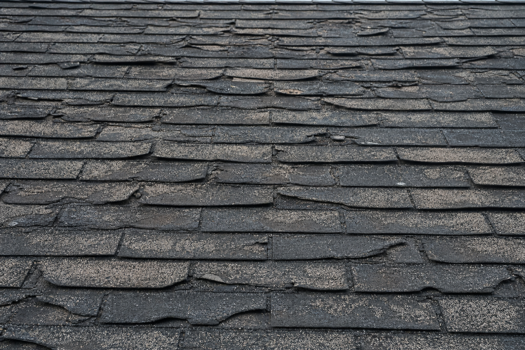 Aged roof showing widespread wear signaling replacement